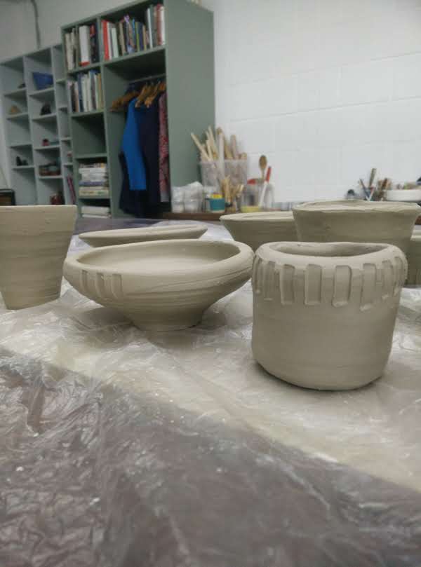 Assorted clay vases and bowls prior to being baked in the kiln